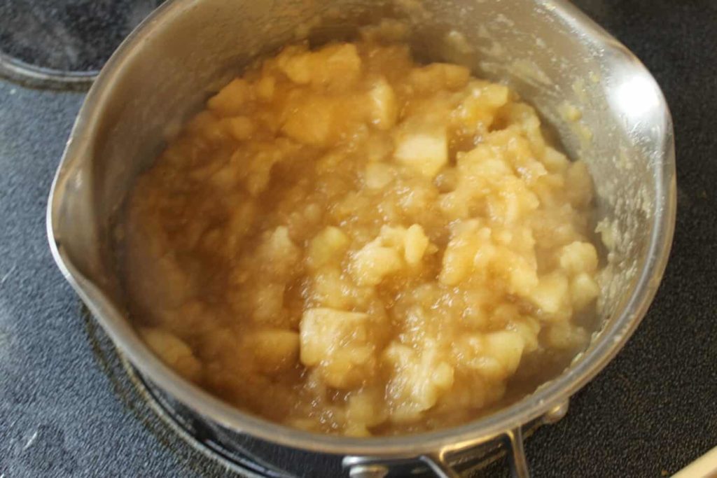 cooked apple pie filling in a pot on the stove
