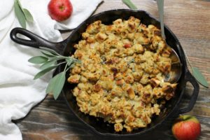 Easy to make, moist, and full of flavor, this apple and sage stuffing cooked in a cast iron skillet will become your new favorite dressing recipe! #skillet #stuffing #dressing #thanksgiving #apple