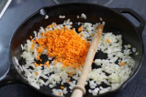 Sweat the onion, carrots, and garlic in your cast iron skillet, being careful not to brown them!