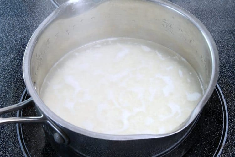 basmati rice simmering in a pot on the stove