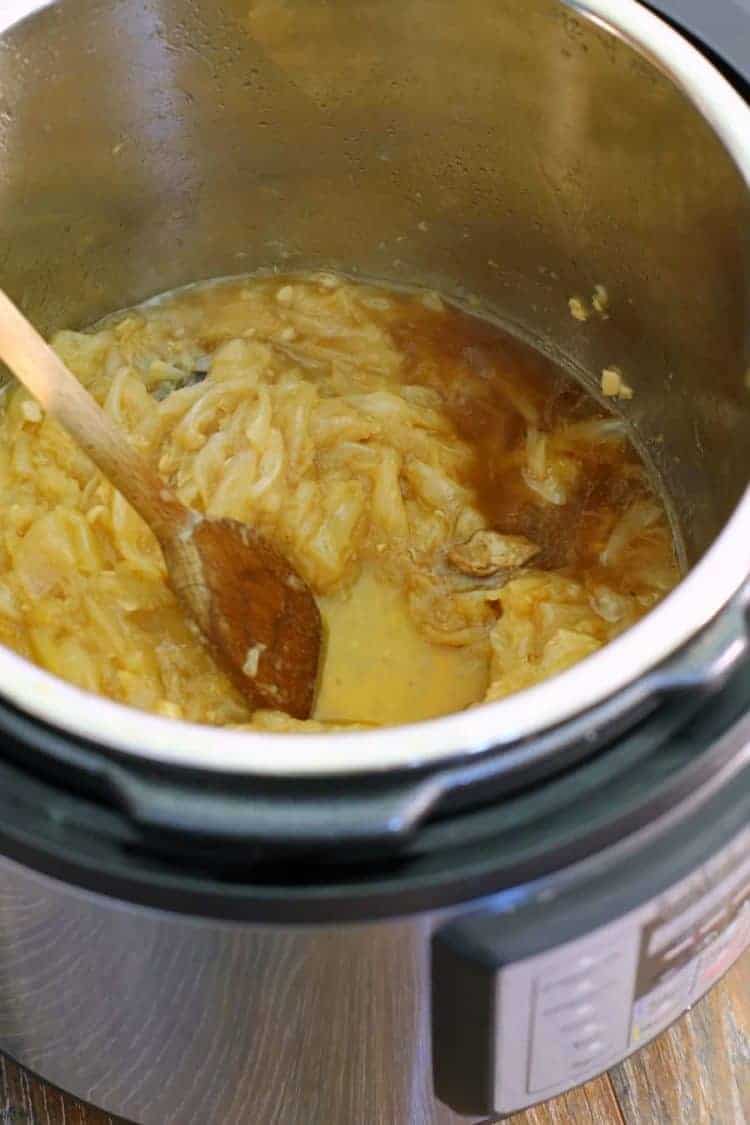 an instant pot with caramelized onions inside