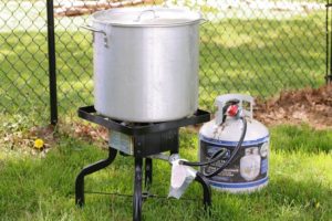 A propane lobster cooker and pot in the garden