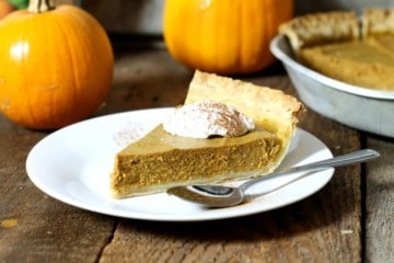 close up shot of a slice of dairy free pumpkin pie