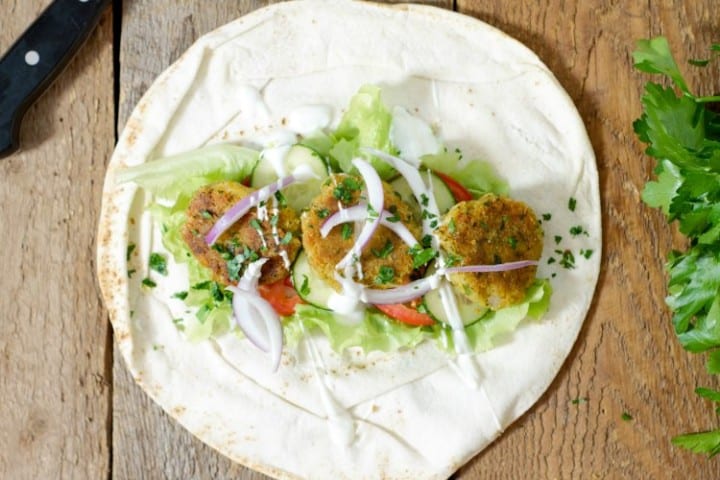 overhead shot of a falafal wrap before being rolled up