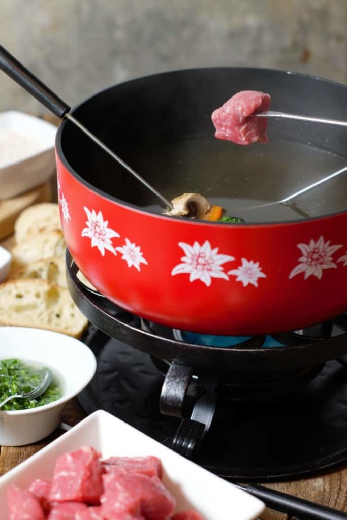 Fondue Bourguignonne  Traditional Meat Dish From Switzerland, Central  Europe