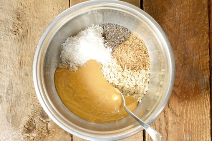 ingredients for peanut butter protein balls in a steel bowl