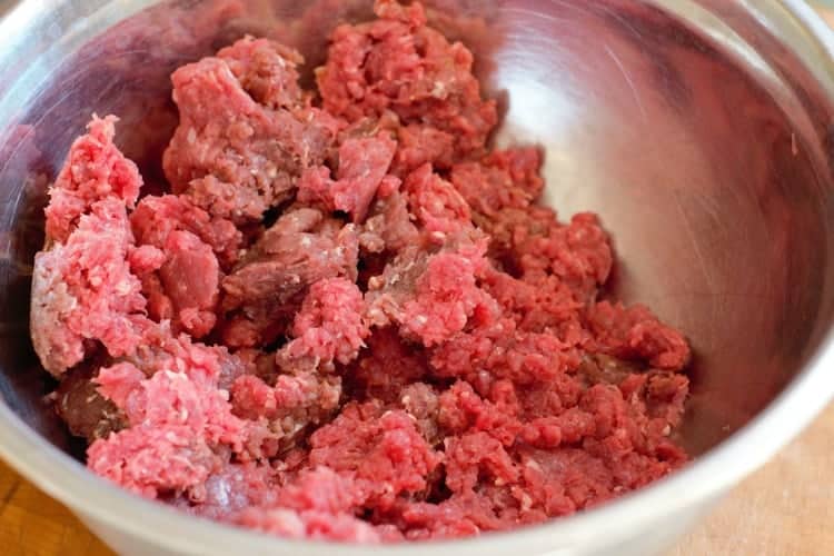 ground moose meat in a steel bowl