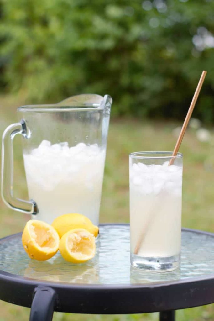real old fashioned lemonade in a glass on a table outside