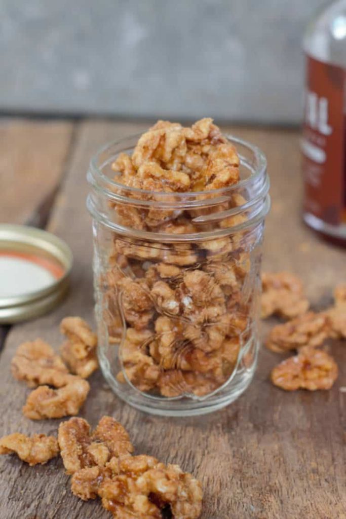 maple candied walnuts in a glass mason jar