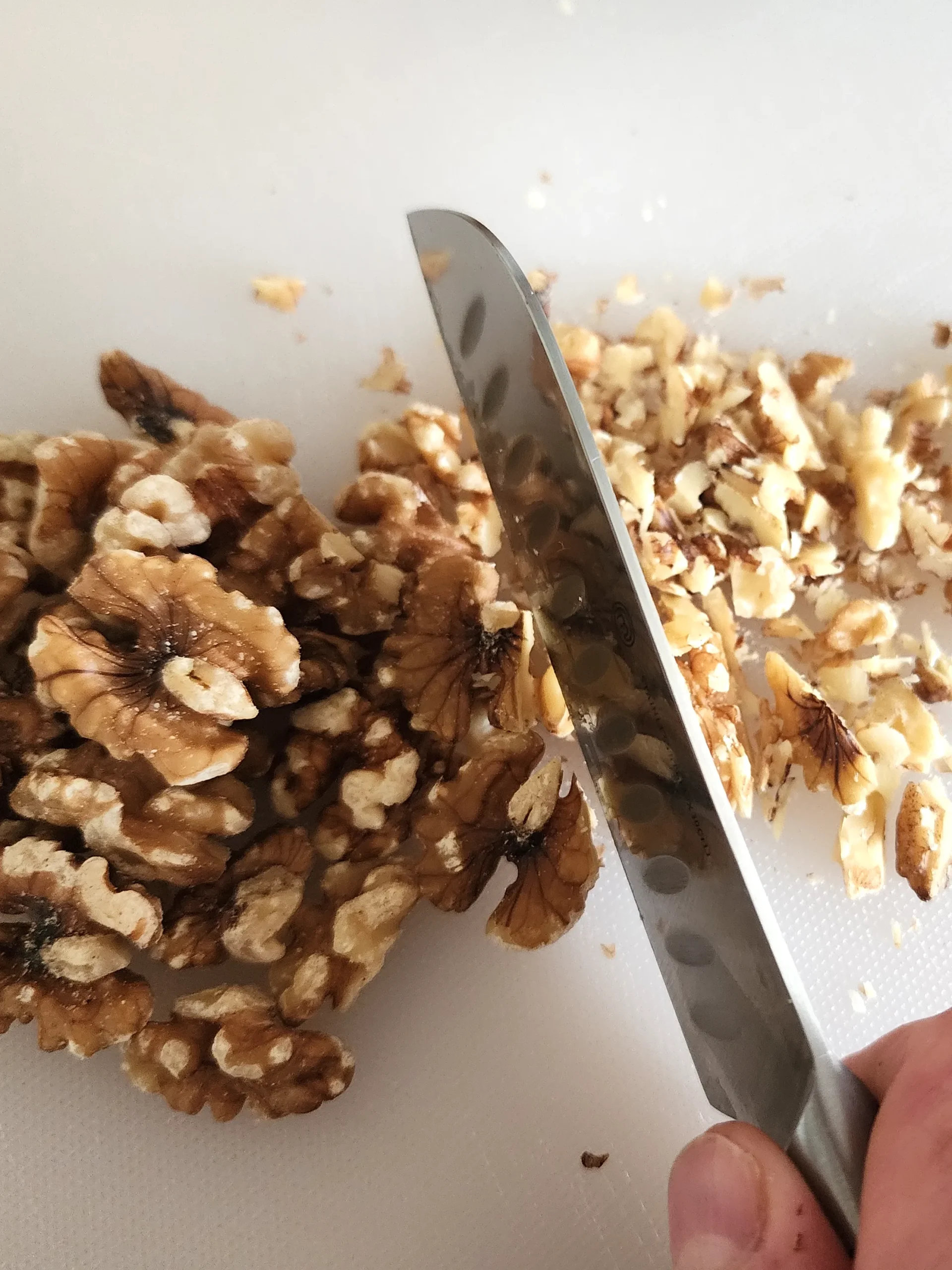 Dicing walnuts for homemade dukkah spice