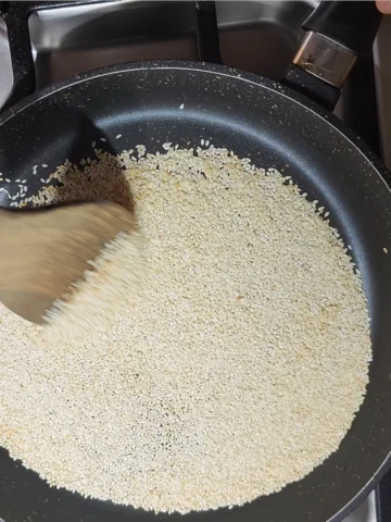 Toasting the sesame seeds for homemade dukkah spice recipe