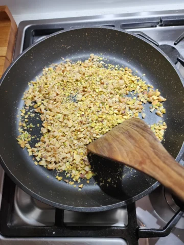 Toasting the walnuts and pistachios for homemade dukkah spice recipe